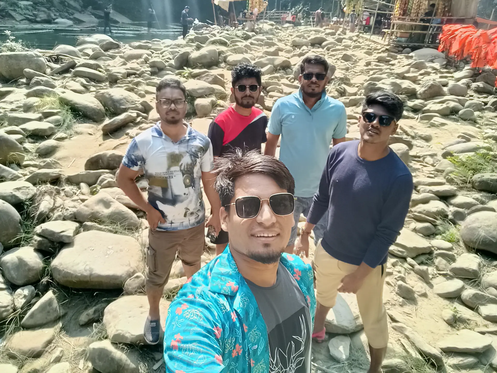 ভেলার ঘাটে পাথরের ওপর আমরা পাঁচ জন